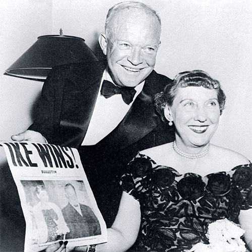 President Dwight D. Eisenhower and his wife, Mamie, hold up the front page of a newspaper in 1950 announcing his election victory. (Getty Images)